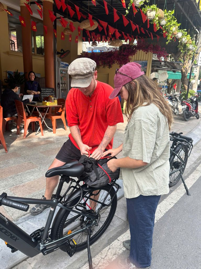 Customer receiving an E-Bike Rental Cat Ba from VietNam Venture